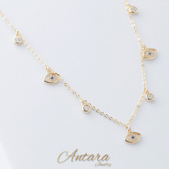 Collar dorado de ojos