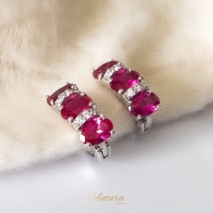 Aretes huggies cristal magenta